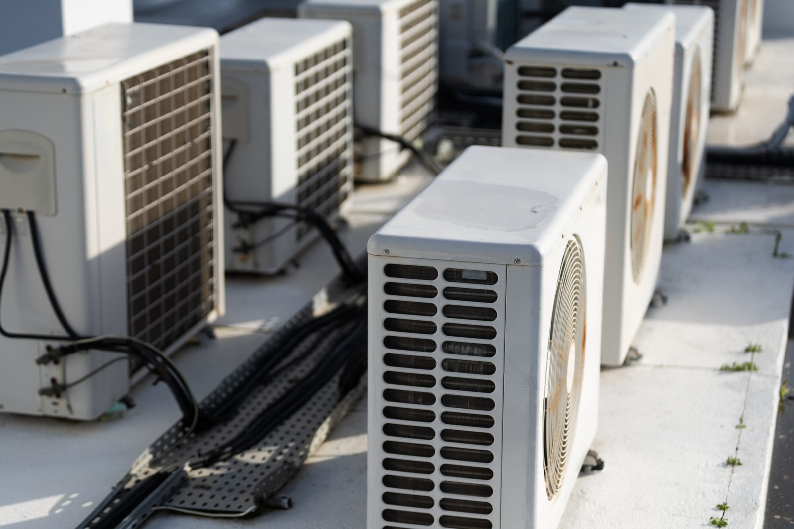 Row of commercial heat pump units on a rooftop
